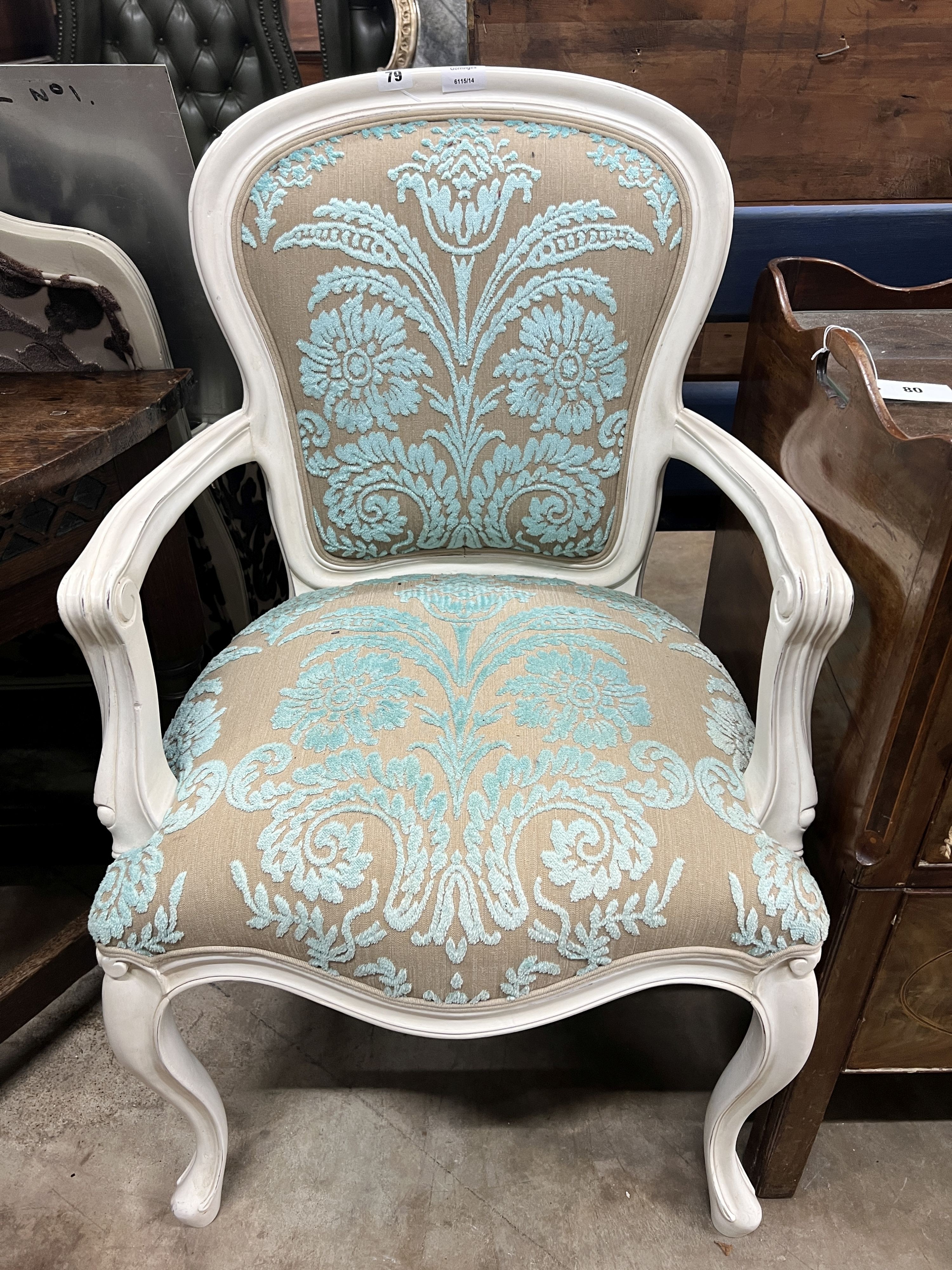 A French style painted upholstered open armchair, width 54cm, depth 50cm, height 95cm